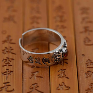 
                  
                    Om Mani Pud Me Hum & Garnet Buddhist Ring
                  
                